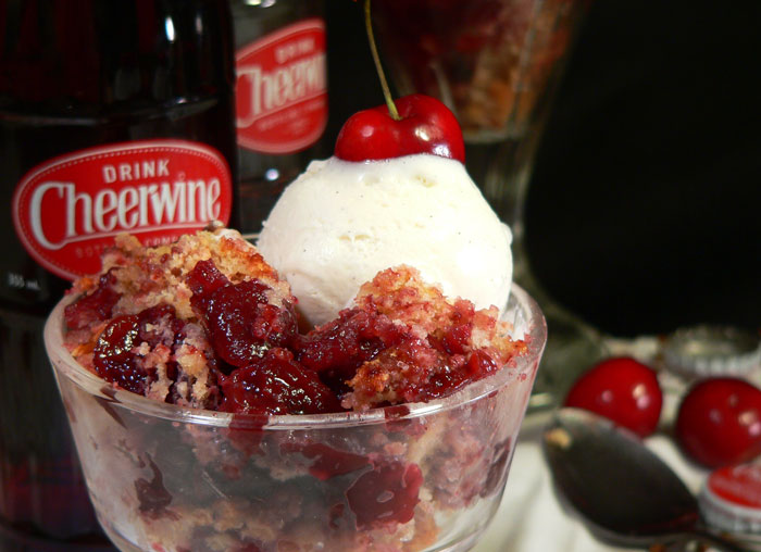 Serve a generous portion of your warm Cheerwine cherry cobbler with a scoop of vanilla ice cream. Enjoy!