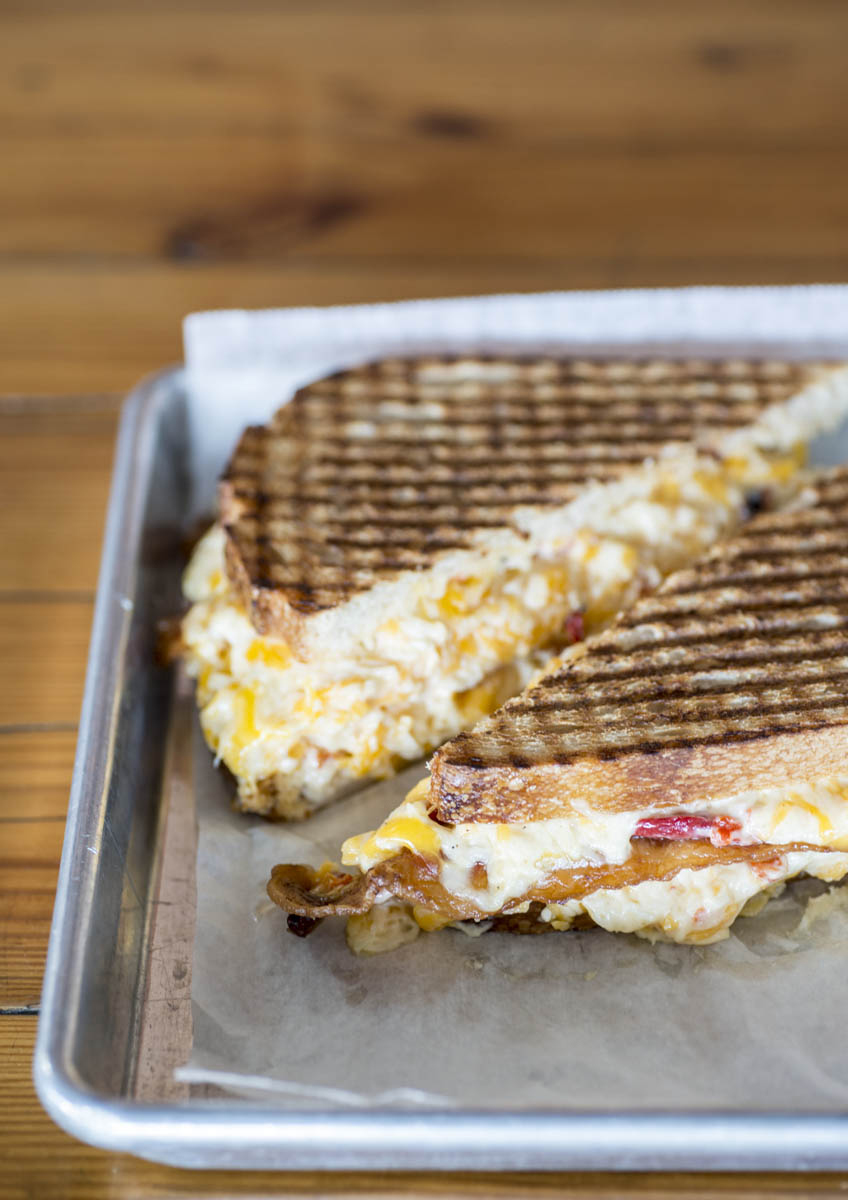 Where do you get yours? Musten & Crutchfield in Kernersville? Conrad & Hinkle in Lexington? Dozens of pimento-cheese purveyors in North Carolina are all waiting for you to try theirs, preferably between two slices of toasted bread. • Photo by Lissa Gotwals.