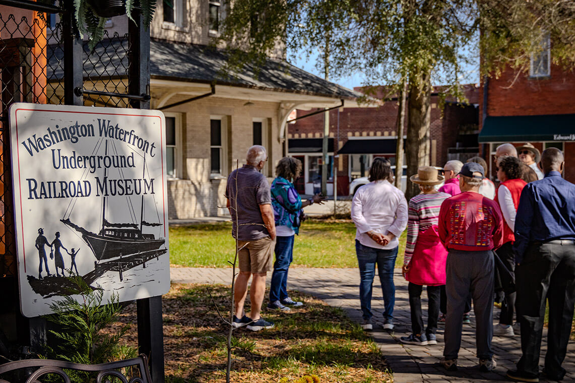 Tour group visits the Washington Waterfront Underground Museum