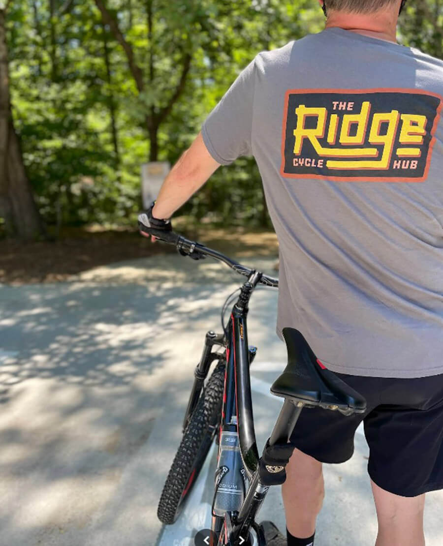 Cyclist wearing a Ridge Cycle Hub t-shirt