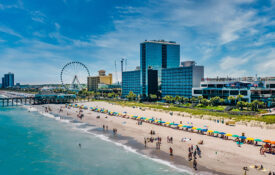 Overhead view of Myrtle Beach with towering hotels and observation wheel