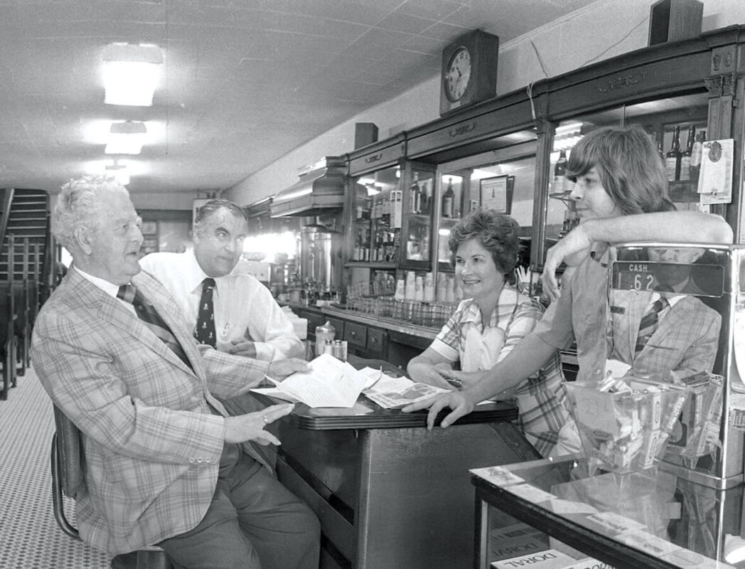 Black and white photo of patrons at The Mecca in Raleigh