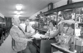 Black and white photo of patrons at The Mecca in Raleigh