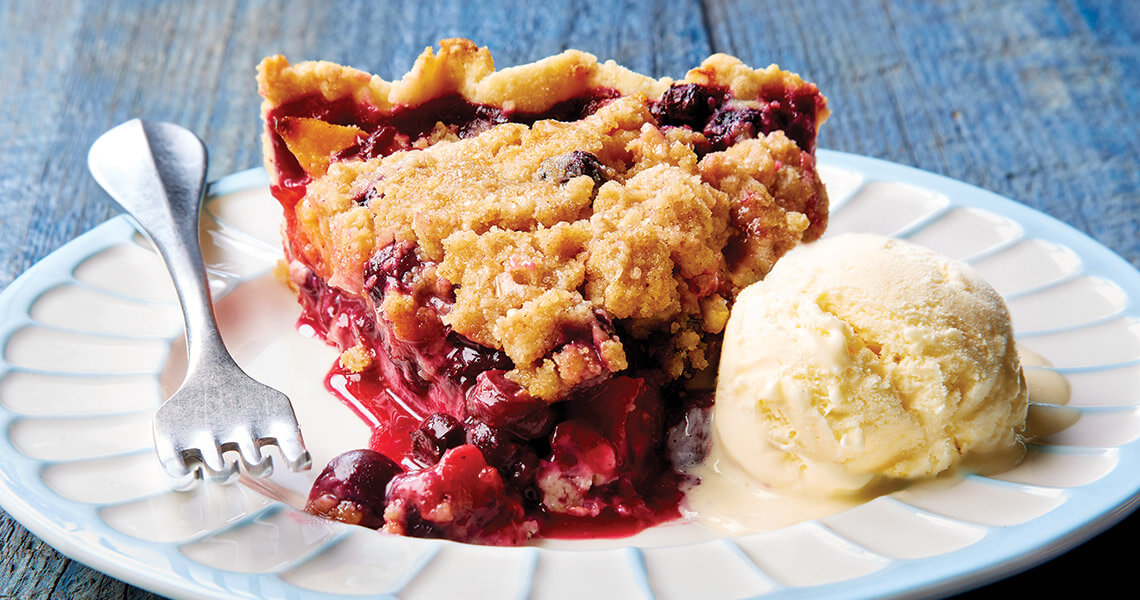 Peach and blueberry pie with ice cream