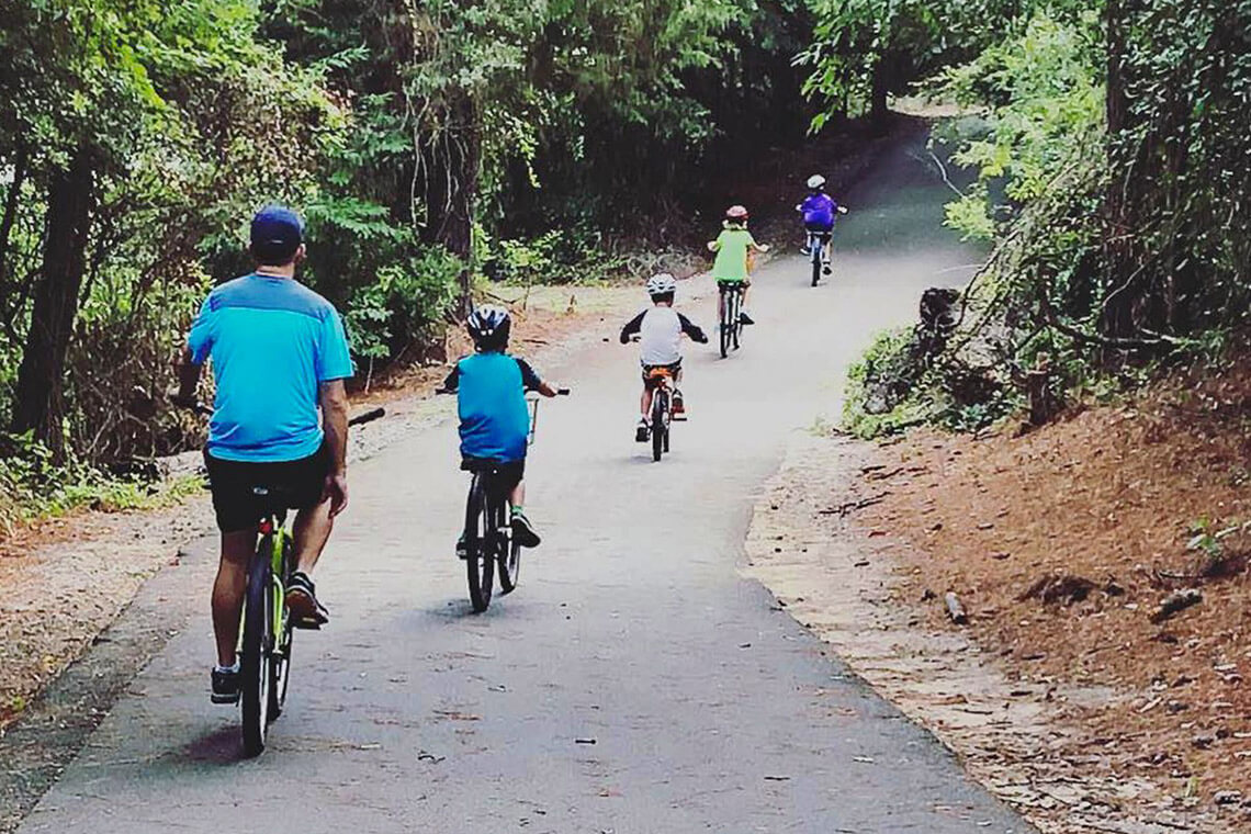 Family biking along the Emerald Isle bike path