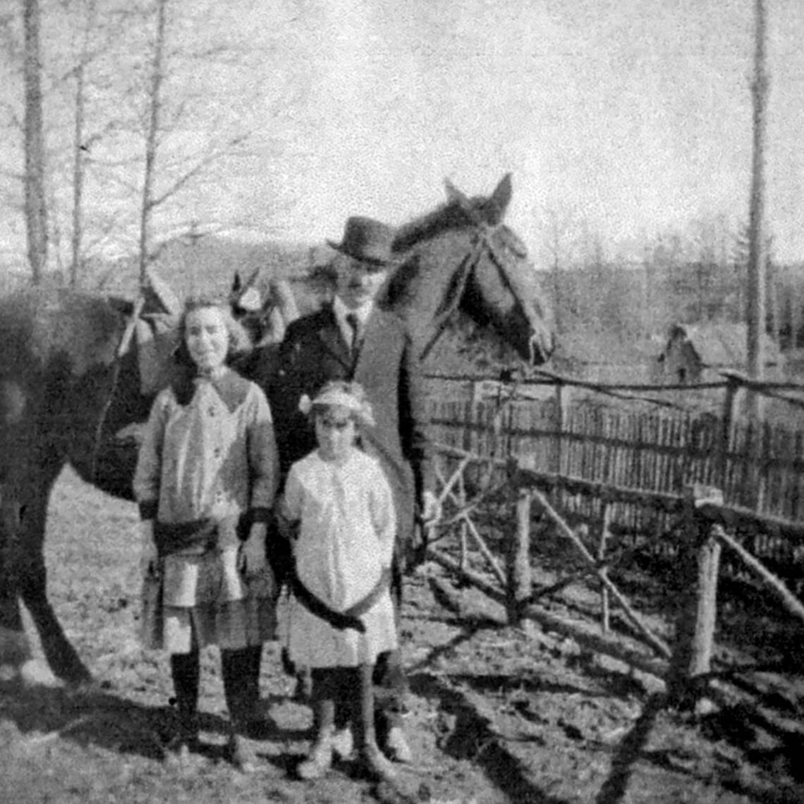 Tufts with his daughters, Margaret and Mary, next to a horse
