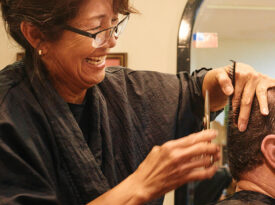 Mai McLean cutting to hair