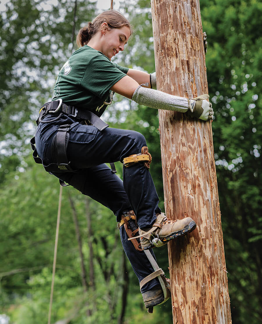 Abbie Almstead competes on Pole Climb