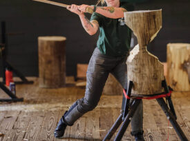 Dana Charles chopping a piece of wood at the Haywood Community College lumberjack school.
