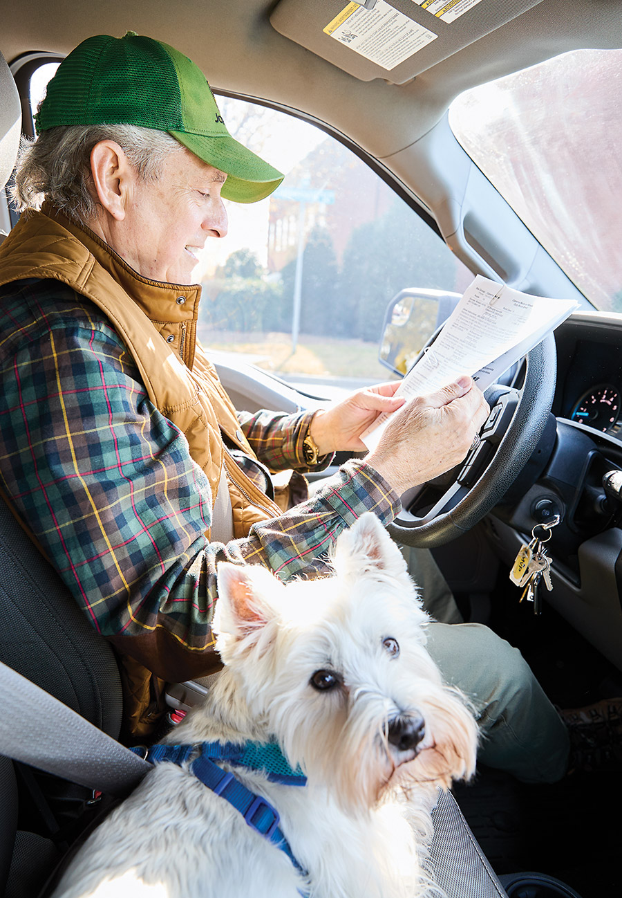 Plummer in the truck with his Westie