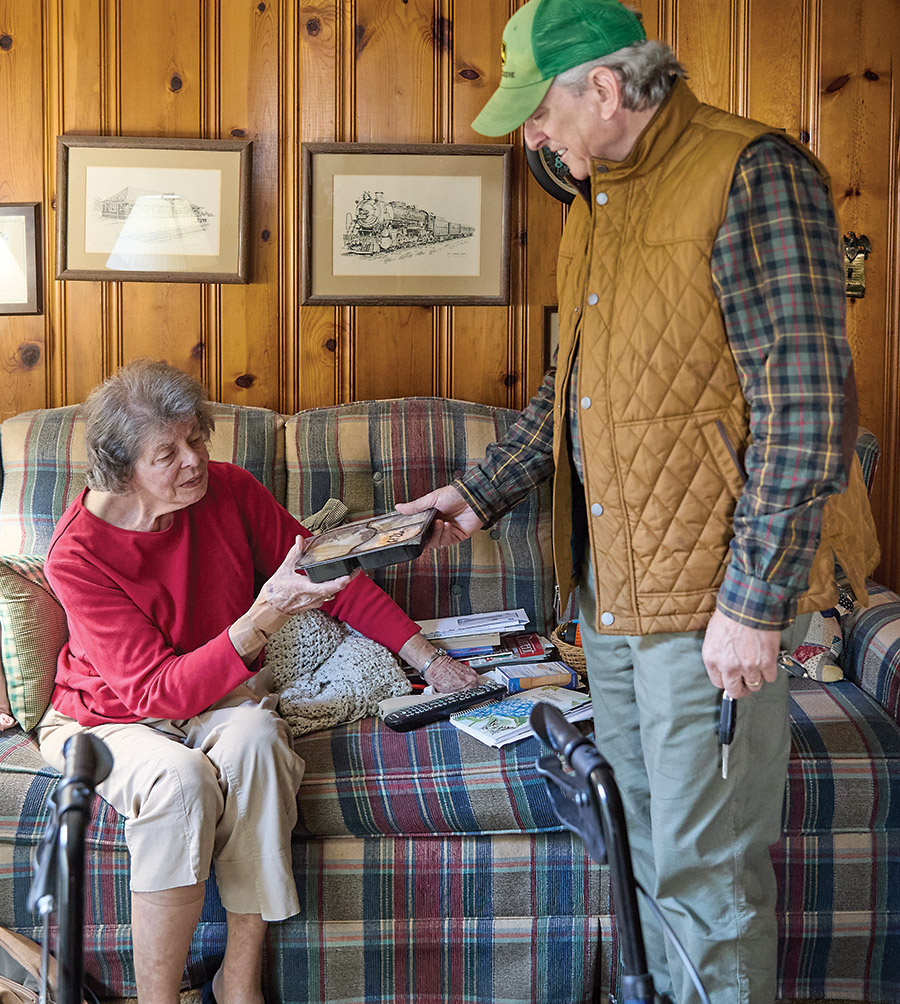 Plummer delivers a meal to Mildred Watts