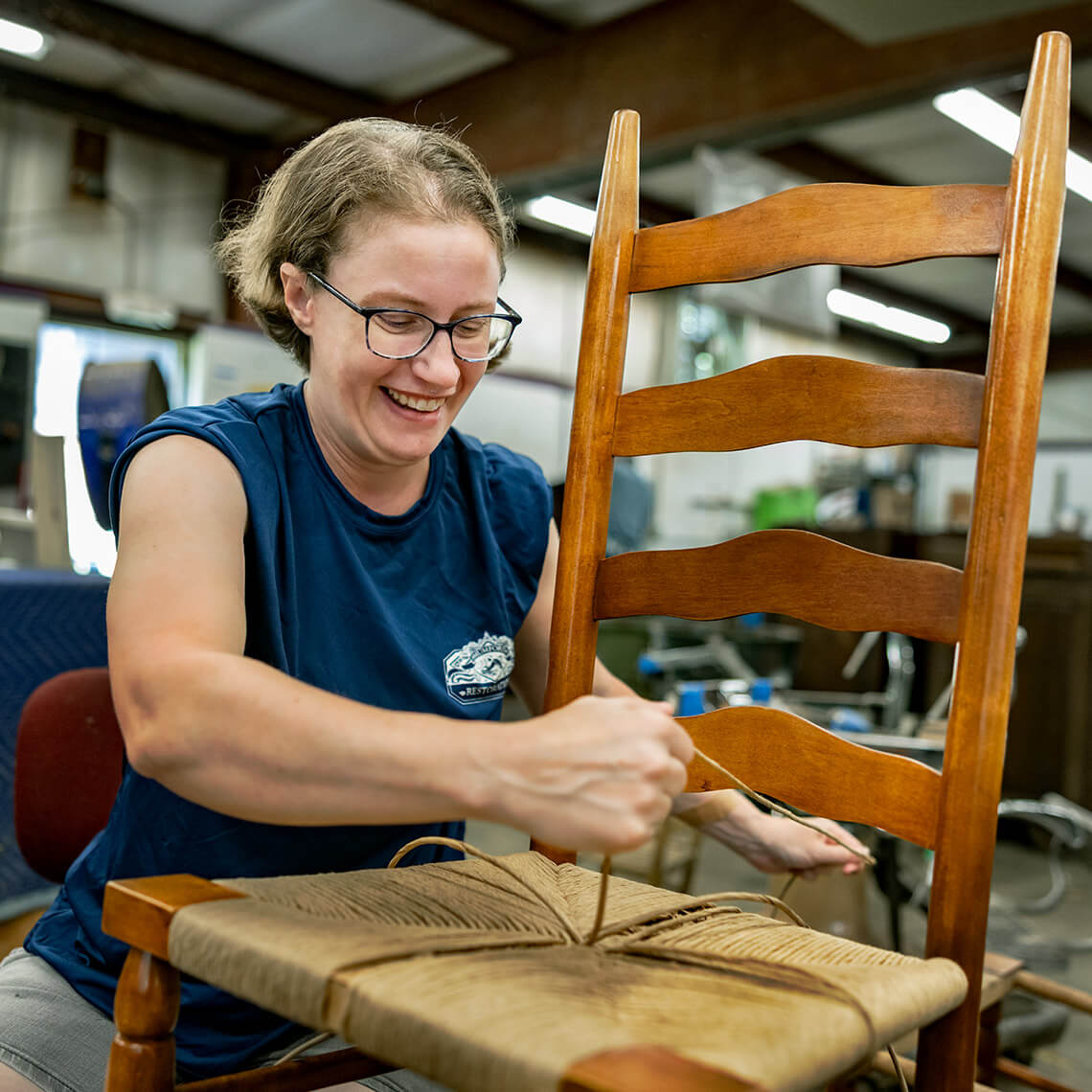 Sarah Reese canes a chair