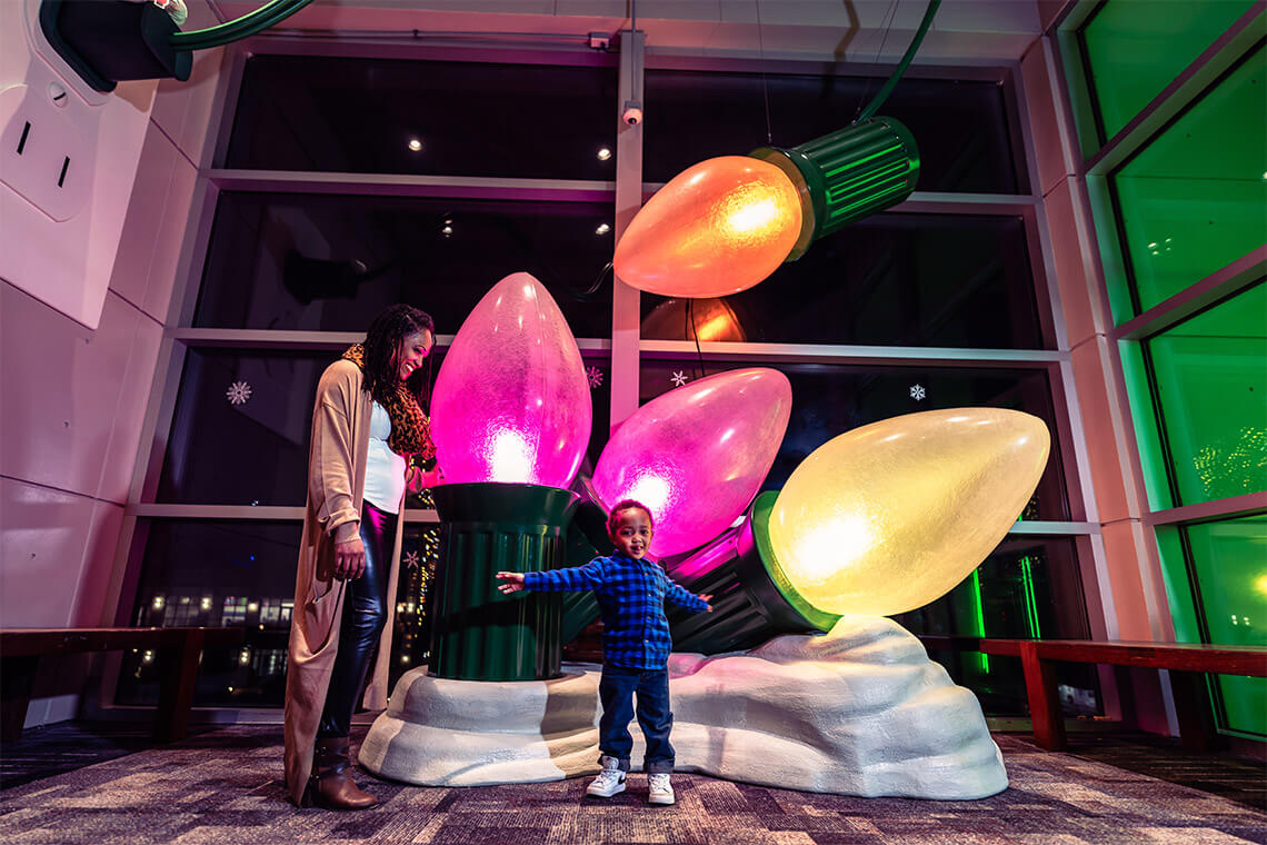 Mom and child at the exhibit at Aquarium Aglow
