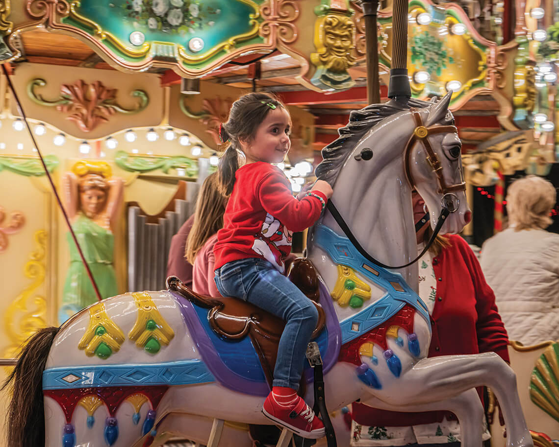 Child on the Village Park Carousel