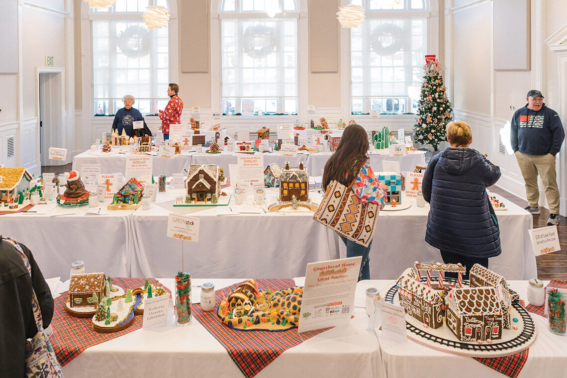 People admire the gingerbread house submissions at the Wilkes Literacy Gingerbread House Fesitval