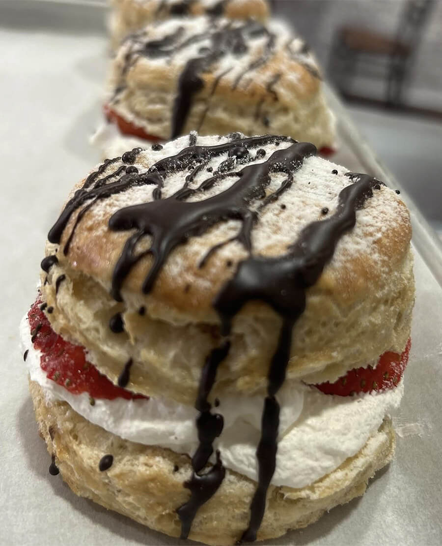 Scones topped with chocolate drizzle