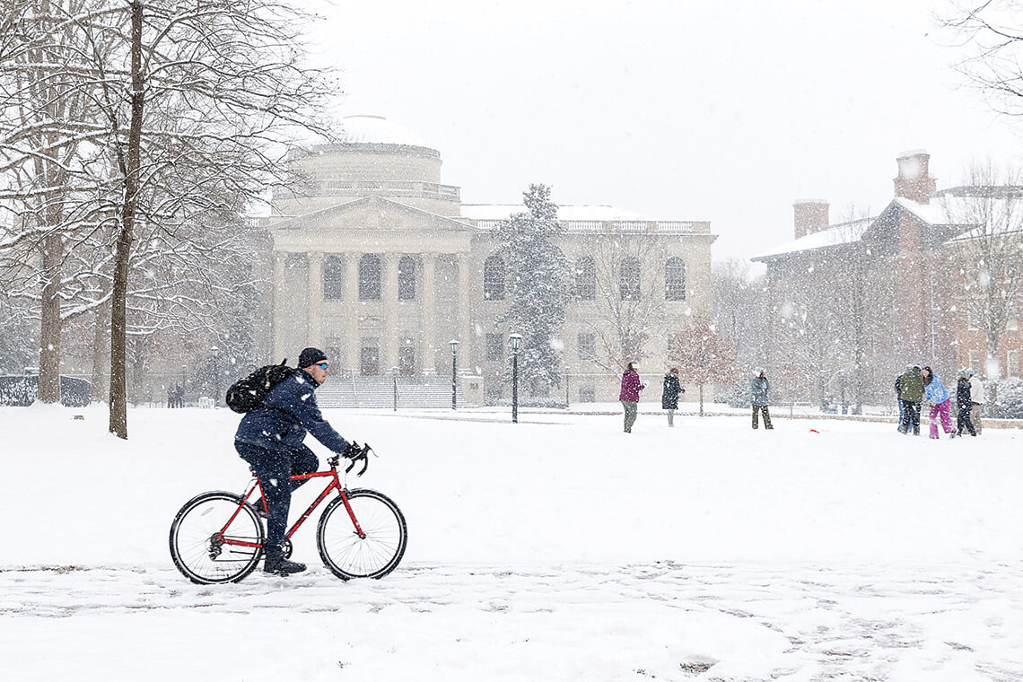 Students play in the snow at UNC's campus