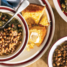 Bowl of field peas, cornbread, and collard greens on the table