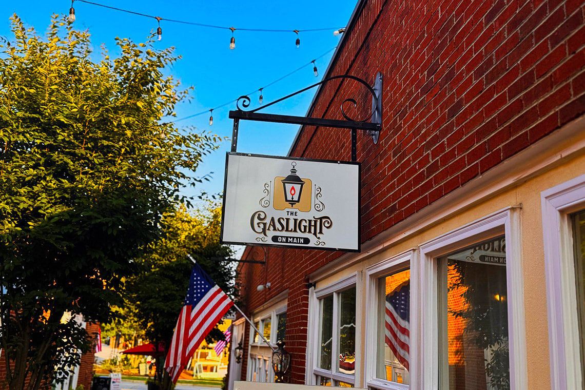Sign and door of Gaslight on Main