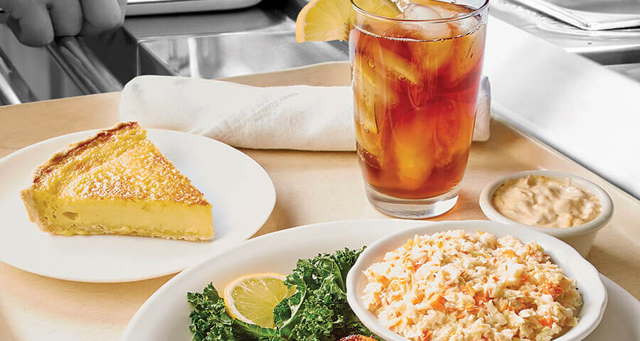 Cafeteria tray with cod, slaw, and egg custard pie