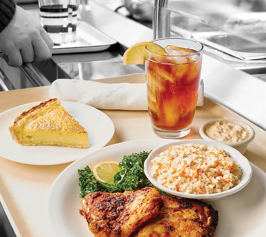 Cafeteria tray with cod, slaw, and egg custard pie