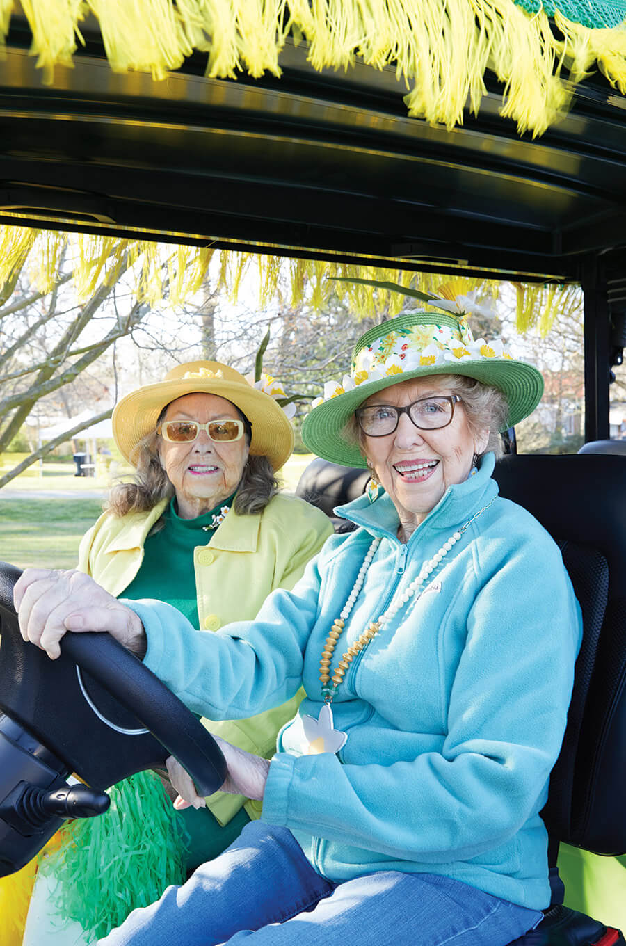 Emily Gamble and Judy Sanders in a golf cart